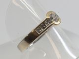 an image of a gold ring with a diamond on it