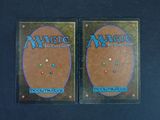 two decks of magic the gathering cards on a black background