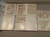 a lot of stamps on the pages of a book
