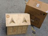 a cardboard box and a cardboard box sitting on the ground