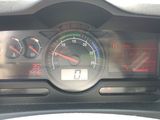 a close up of a car dashboard with a speedometer and gauges