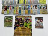 a lot of pokemon cards on the table with a lot of them