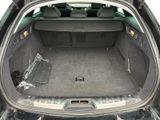 a trunk of a car with the back seats folded down