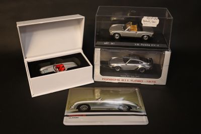 a box with a silver car in it and a box with a silver car in it
