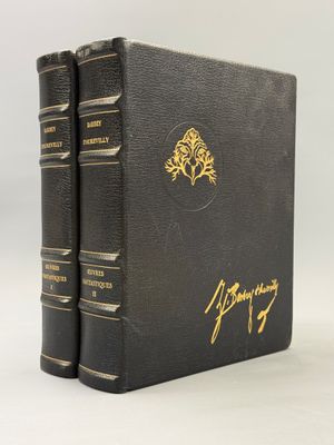 a black book with gold lettering and a tree on the cover