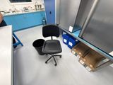 a chair that is sitting in the middle of a room