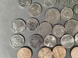 a lot of coins that are on the table