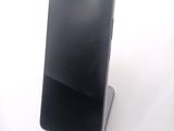 a cell phone that is sitting on top of a stand