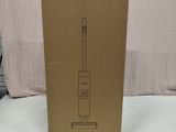 a box with a toothbrush in it sitting on a bed