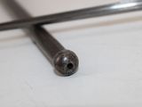 a close up of a metal object on a white surface