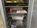 an open refrigerator with eggs and milk in it