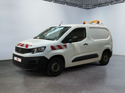 the white van is parked in a white room with a red and white stripe