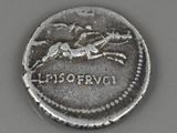 a close up of a silver coin with a horse on it