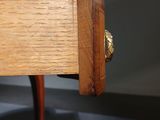 a wooden table with a drawer on top of it