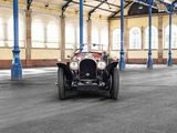a vintage car parked in a large building