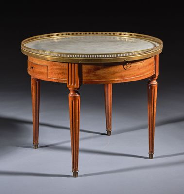 a small table with a marble top and wooden legs