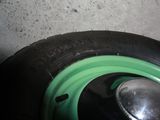 a close up of a tire with a green rim