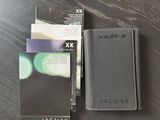 a passport case and a card holder on a table