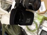 a camera that is sitting on top of a pile of items