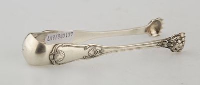 a pair of silverware spoons on a white surface