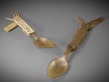 two spoons and a fork on a table