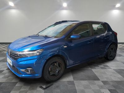 a blue car is parked in a room with a checkered floor