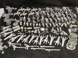 a lot of toy soldiers and weapons on the table