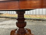 an image of a wooden table with a glass top