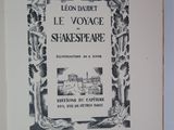 an old book with a picture of a castle in the background
