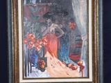 painting of a woman in a red dress on a easel next to a vase of flowers