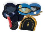 many hats that are laying on top of each other