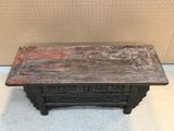 an old wooden table with two drawers on top of it