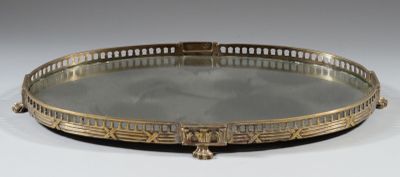 an antique brass tray with a mirror on top of it