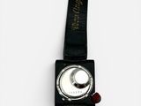 a black watch with a white face on a black strap