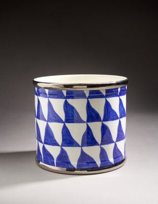 an image of a blue and white cup sitting on top of a table