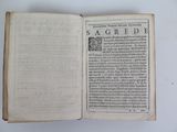 an open book on a table with a white background