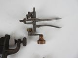two old tools that are laying on a white surface