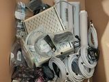 a cardboard box filled with electronics and other items