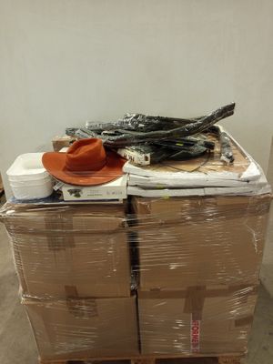 a stack of boxes and a hat on a pallet