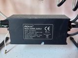 a black power supply sitting on top of a white table