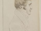 portrait of a man in a suit and tie in a book