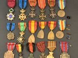 an assortment of medals and medals are displayed on a table