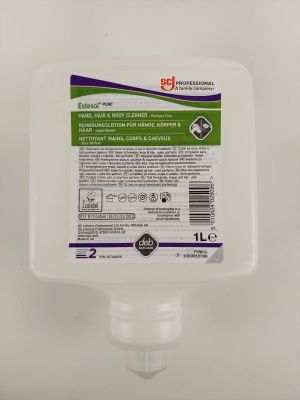 un gros plan d'un flacon de gel hydroalcoolique posé sur une surface blanche