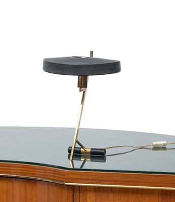an image of a desk with a lamp on top of it
