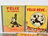three books of felix the cat and felix the cat are on a table