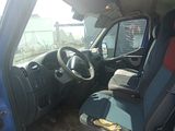 a blue van that has a seat and a steering wheel