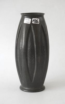 a black vase that has a price tag on it