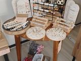 a small table with a lot of jewelry on it