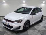 a white volkswagen golf gt with black rims parked on a checkered floor
