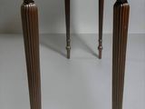 a small wooden table with two legs on a white background